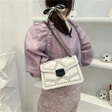 Small Designer Crossbody Bag with Retro Rivet Chain Detail and Durable PU Leather Construction for Women